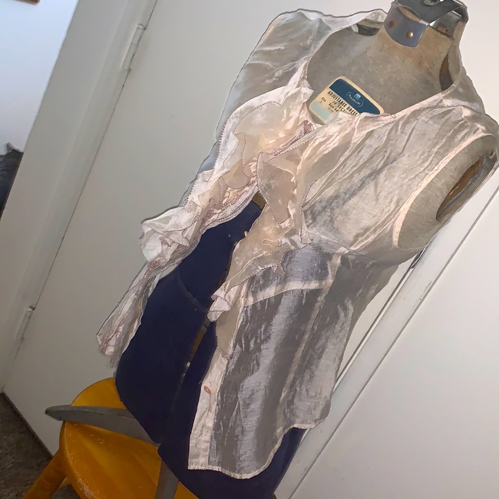 McGinnis sleeveless button down tank top with ruffles.